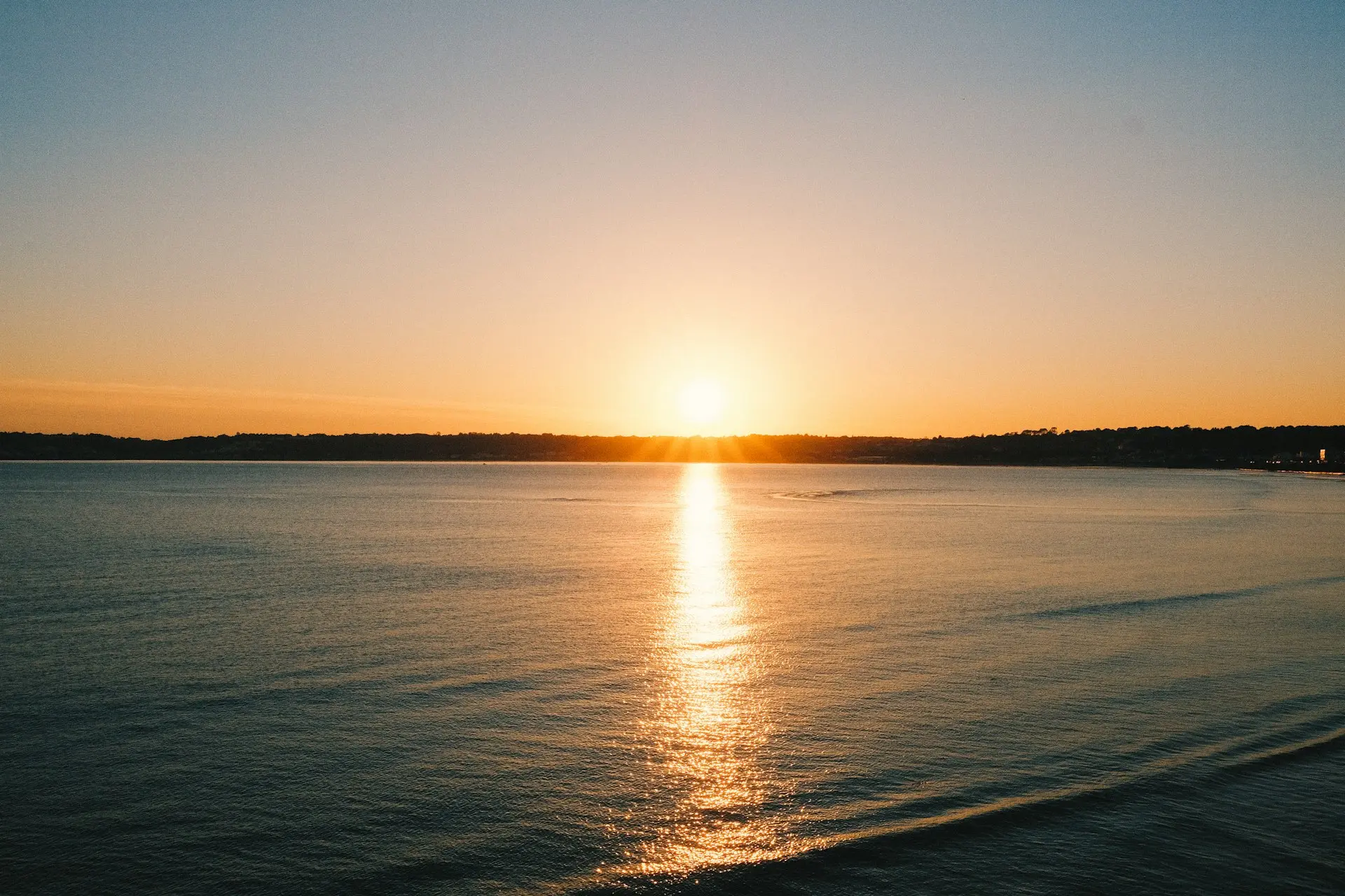 body of water during sunset
