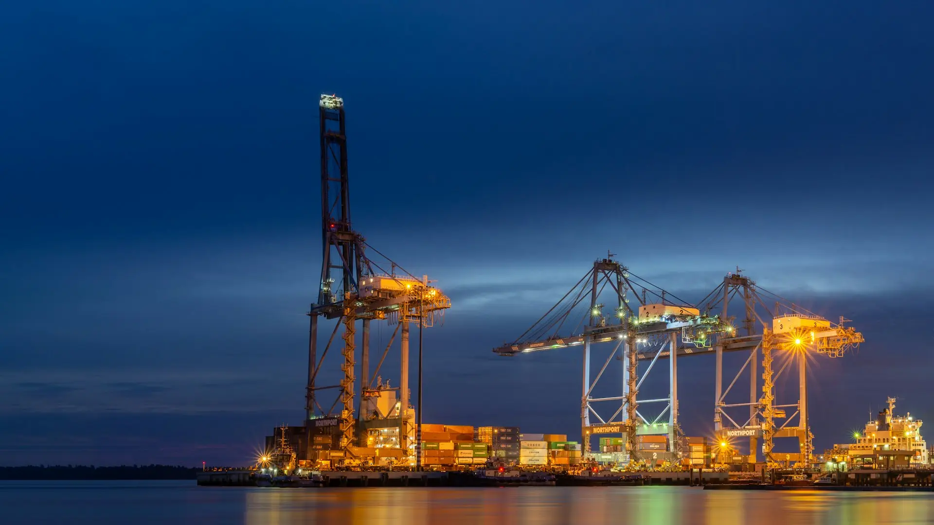 red and blue crane under blue sky during daytime
